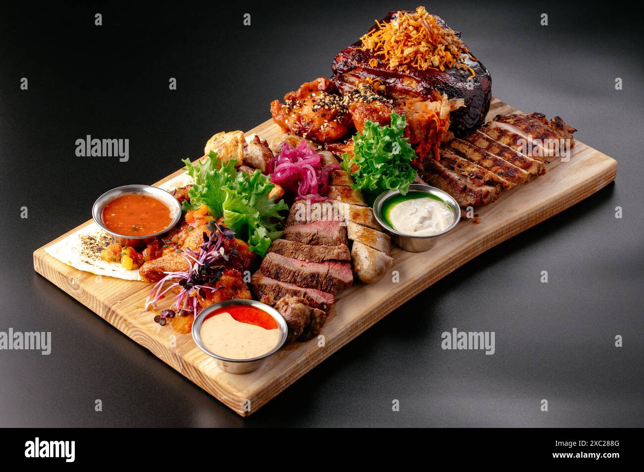 beer snacks on a wooden board. Stock Photo