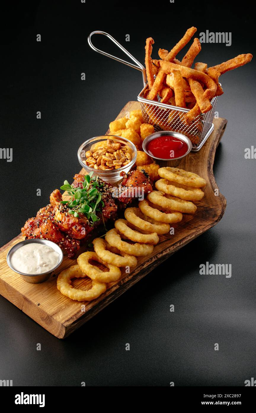 beer snacks on a wooden board. Stock Photo