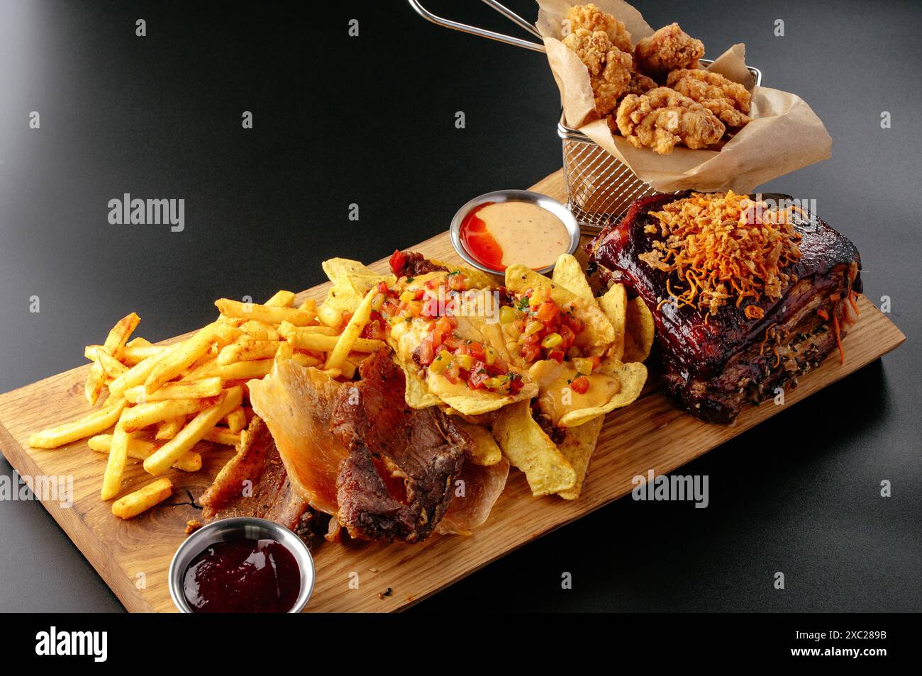 beer snacks on a wooden board. Stock Photo