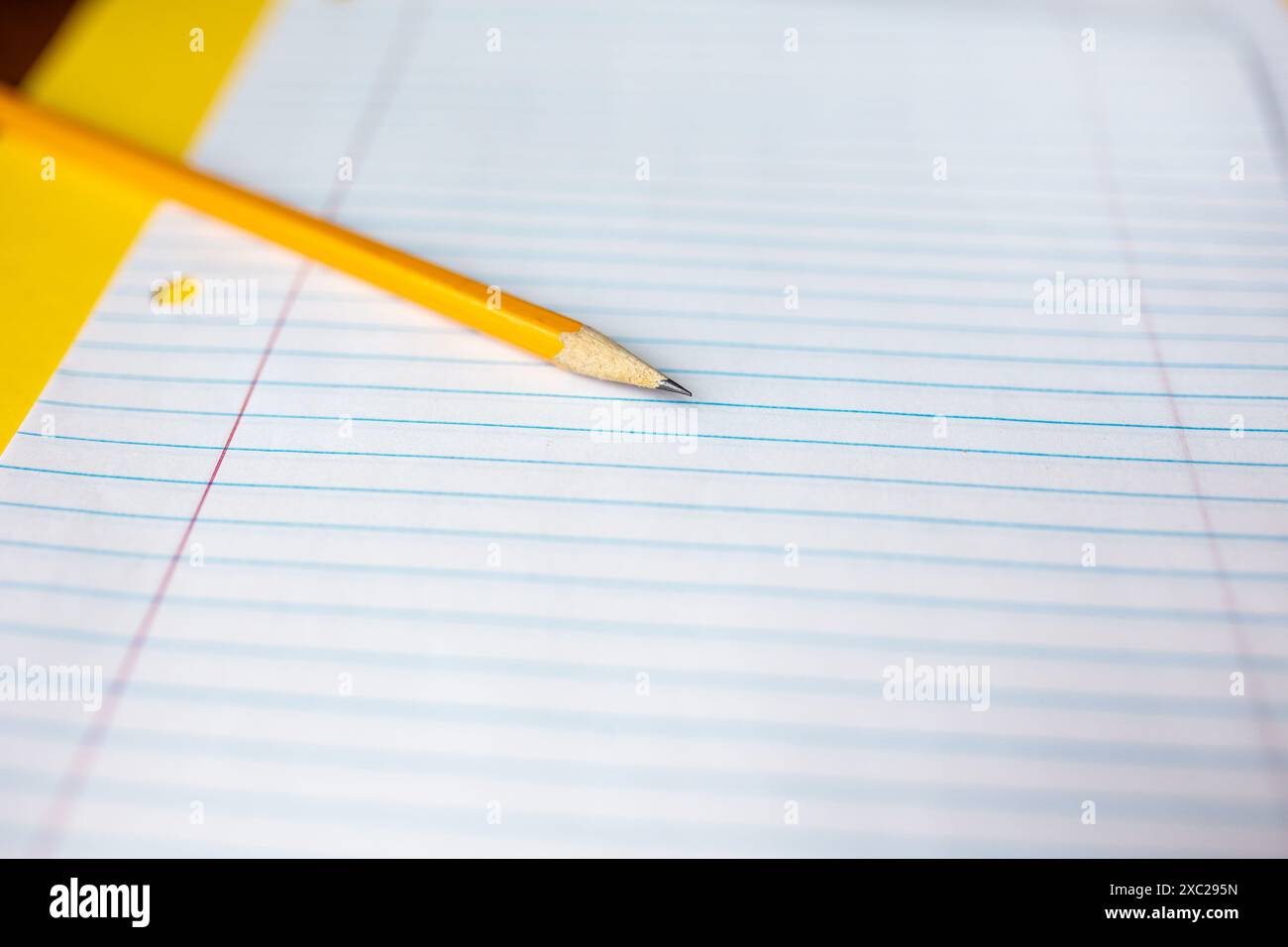 closeup of sharpened pencil against lined paper Stock Photo - Alamy