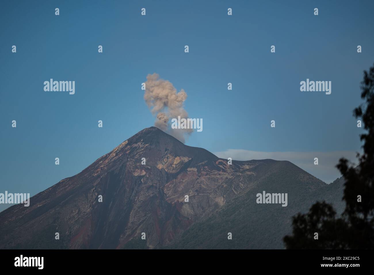 Fuego volcano from Antigua Guatemala during sunrise Stock Photo