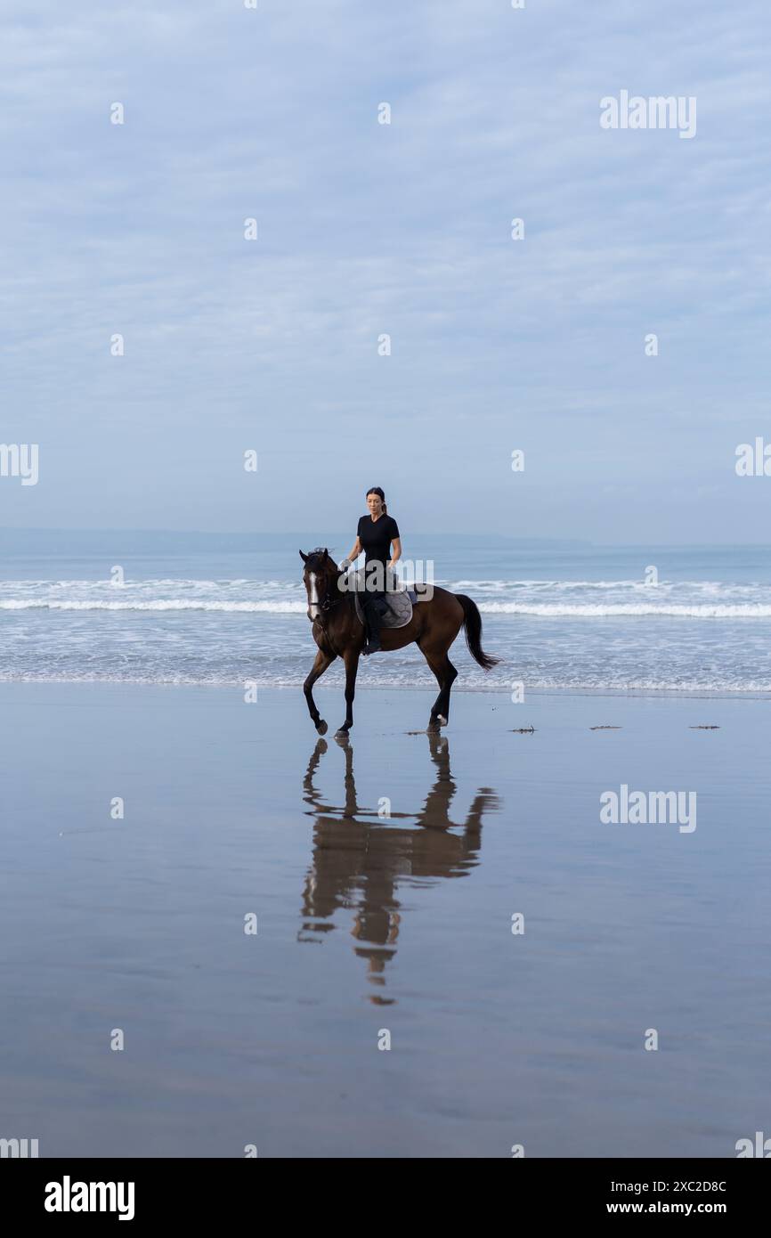 Woman riding a horse on beach hi-res stock photography and images - Alamy