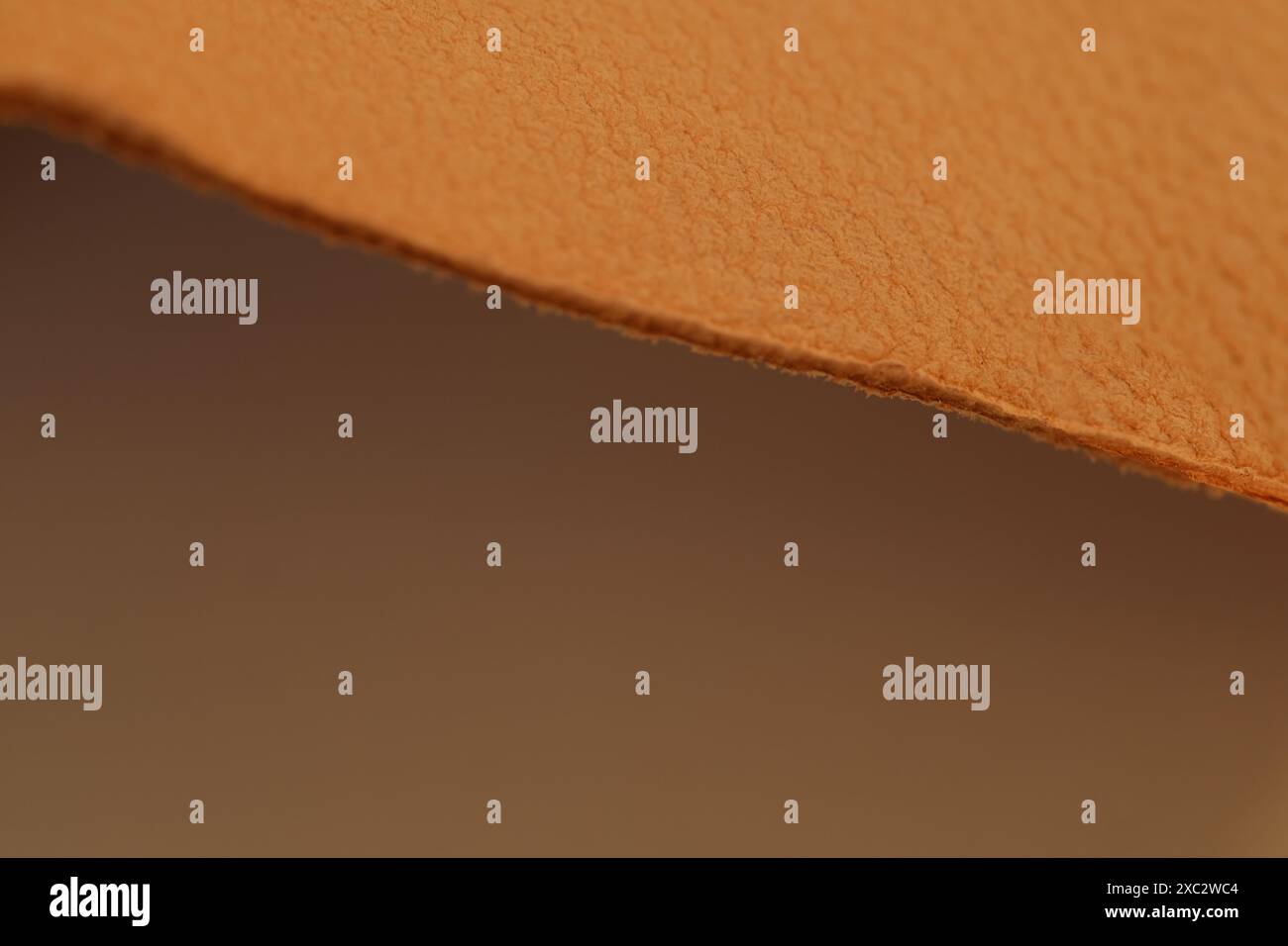 Premium natural leather orange, yellow, brown cut for crafting artisan leatherwork, , natural background for designer, Handmade goods, shoes and insol Stock Photo