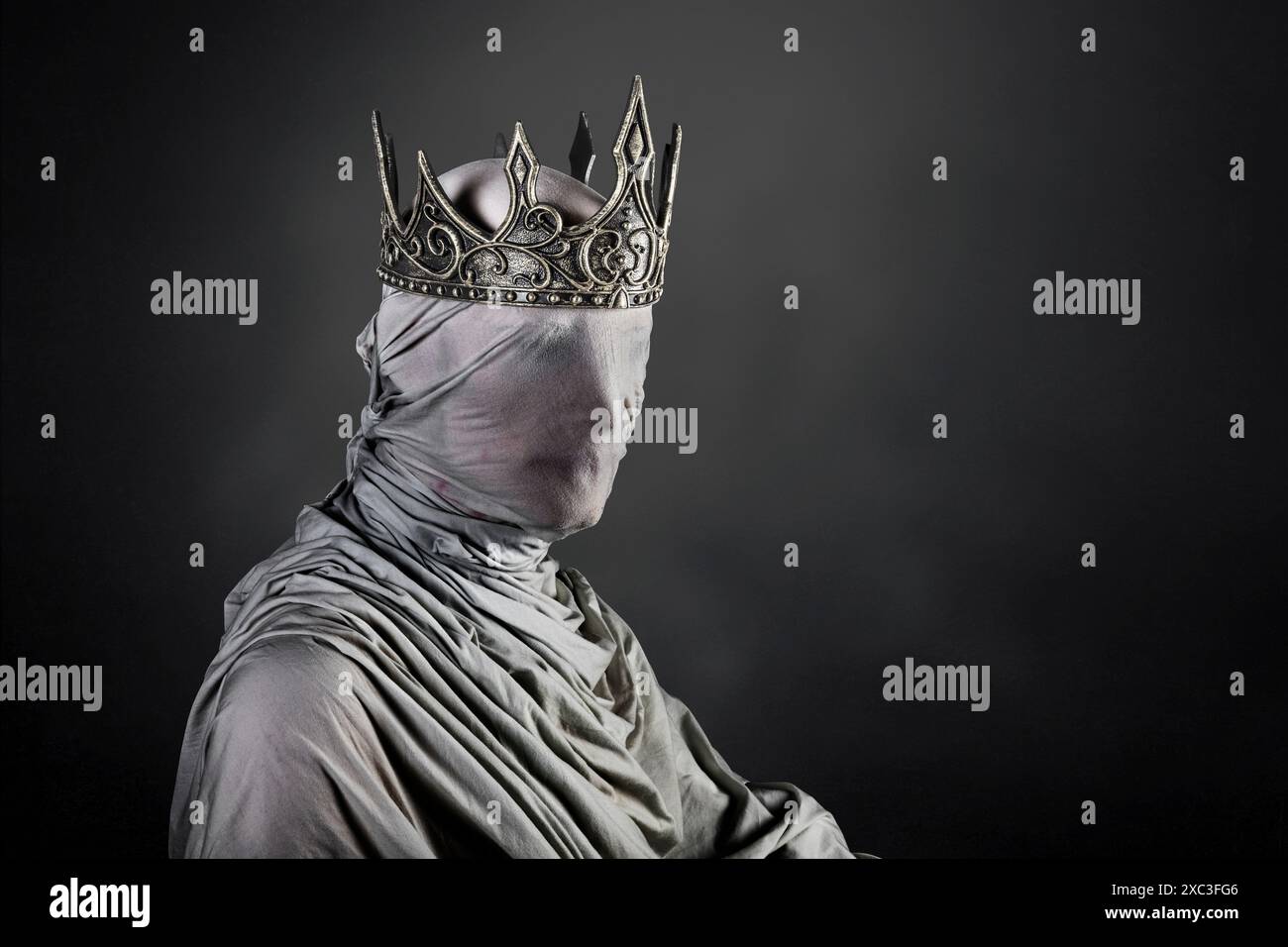 Ghost of a queen or king over dark misty background Stock Photo