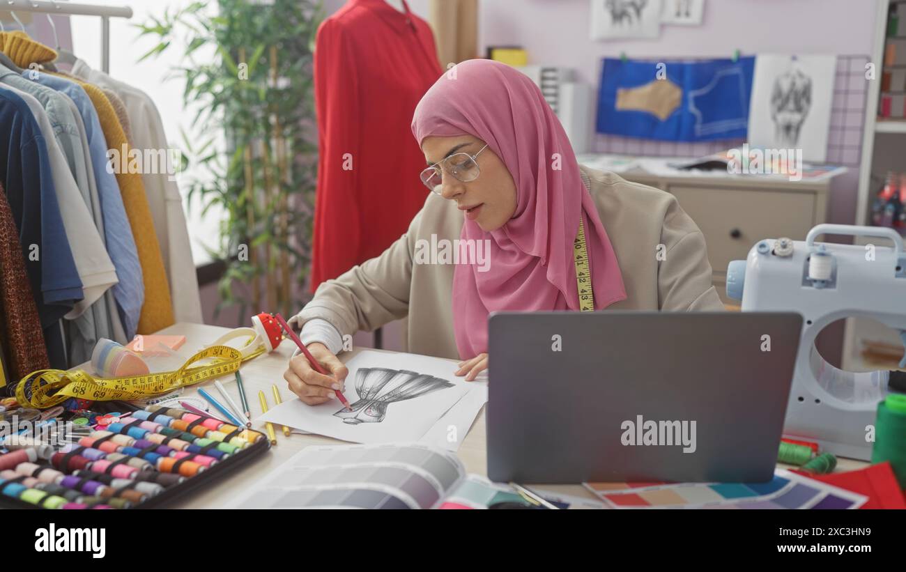A focused woman sketches a dress design in a colorful tailor shop ...