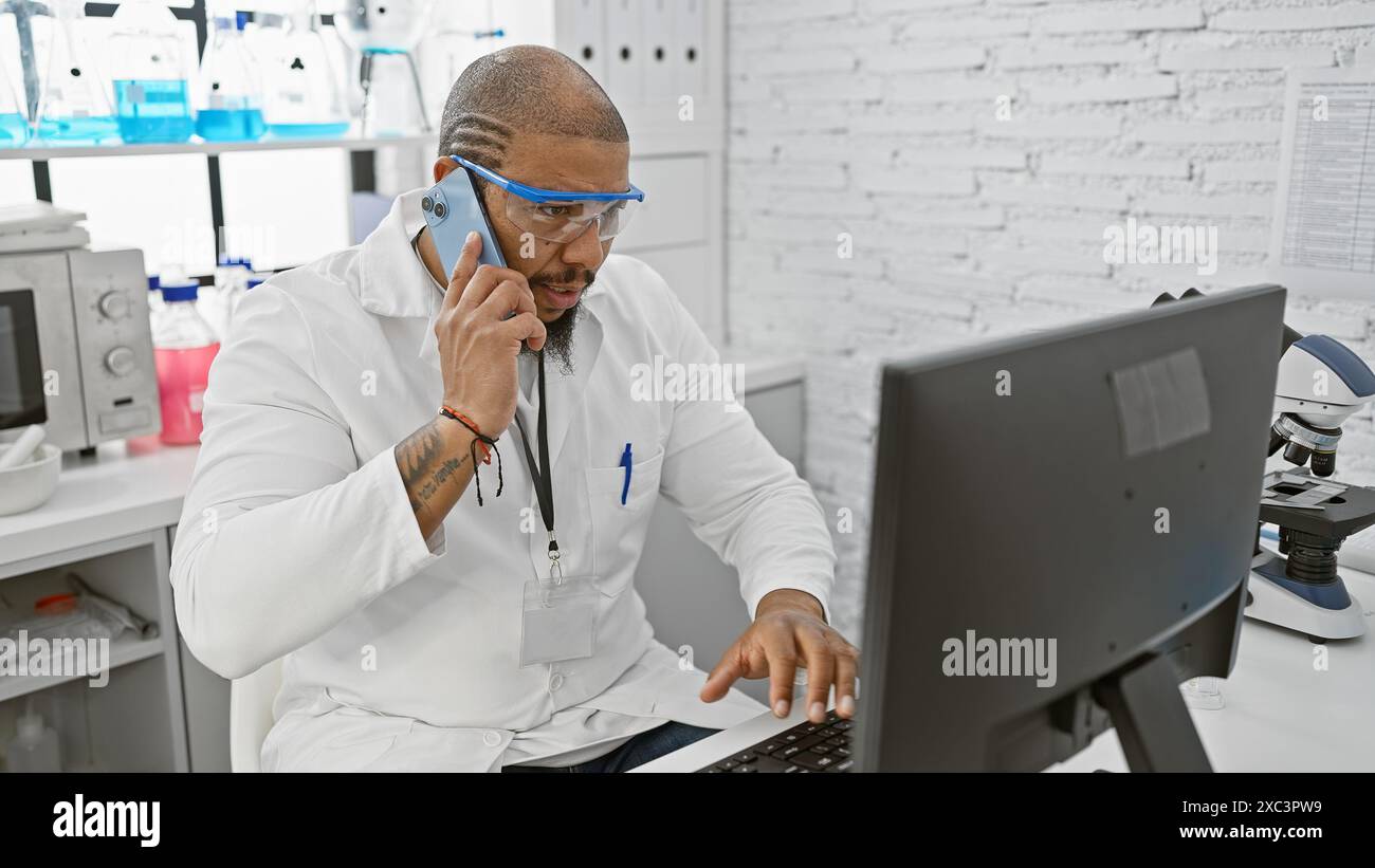 African american scientist in lab coat talking on phone while working ...