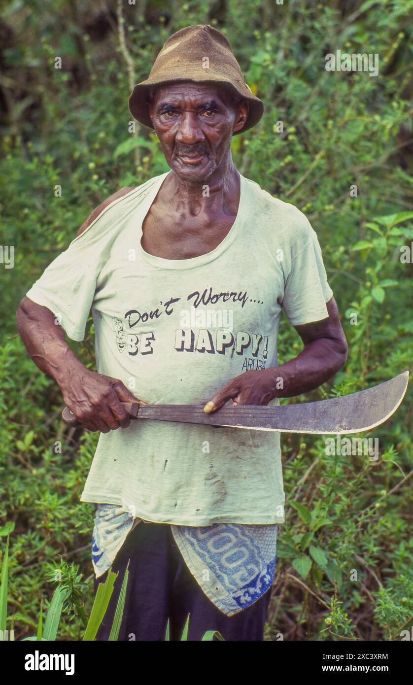 Suriname - man with machete and t-shirt 'Don't worry, be happy' Stock Photo