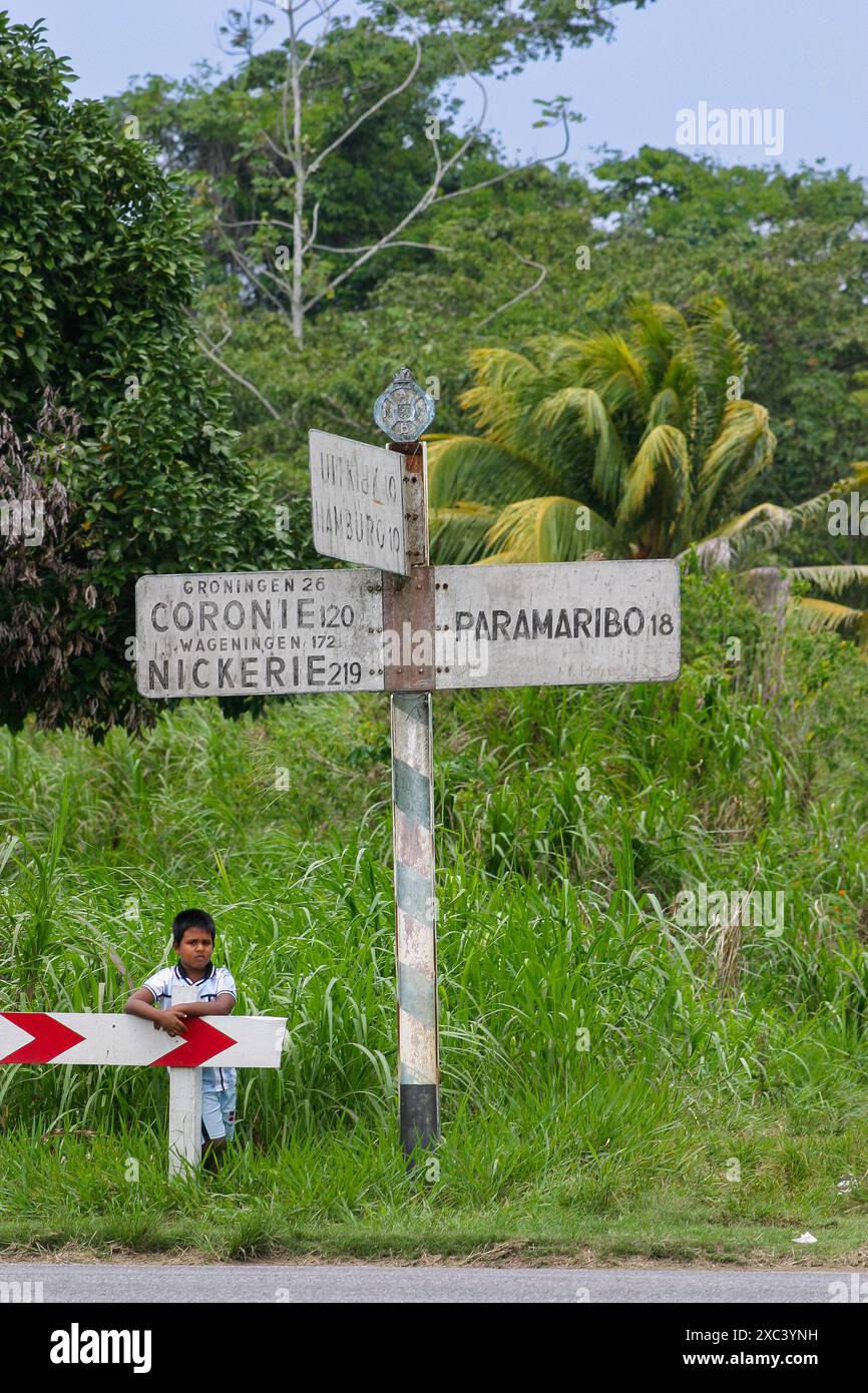 Suriname, Paramaribo area. road sign from the Dutch colonial period, 18 km from Paramaribo. Stock Photo