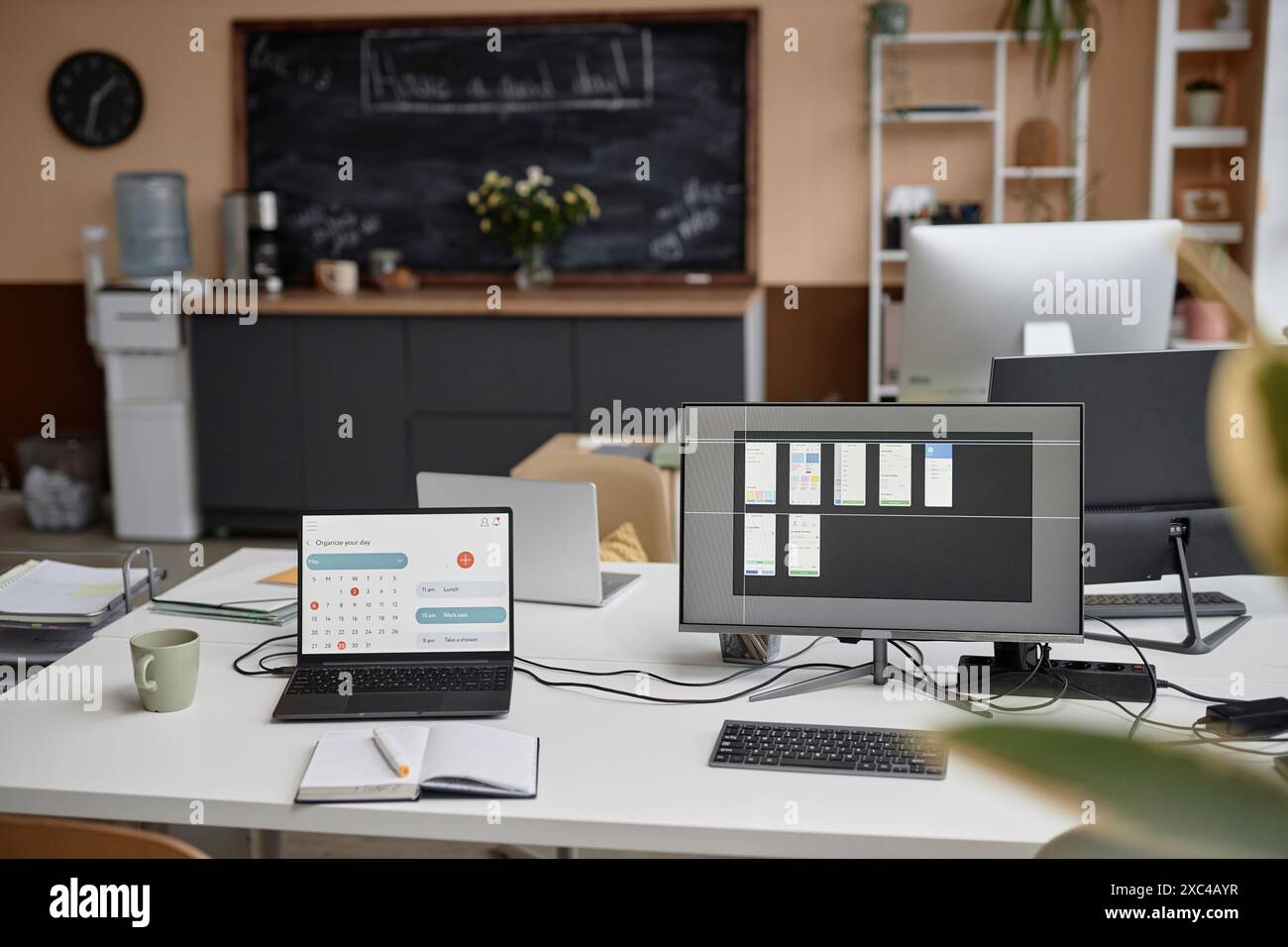 Modern office desk setup equipped with laptop displaying page of ...