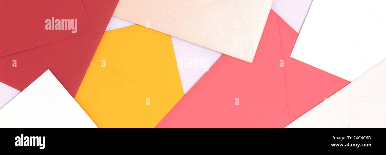 Banner with multicolored envelopes scattered on a blue background. Stock Photo