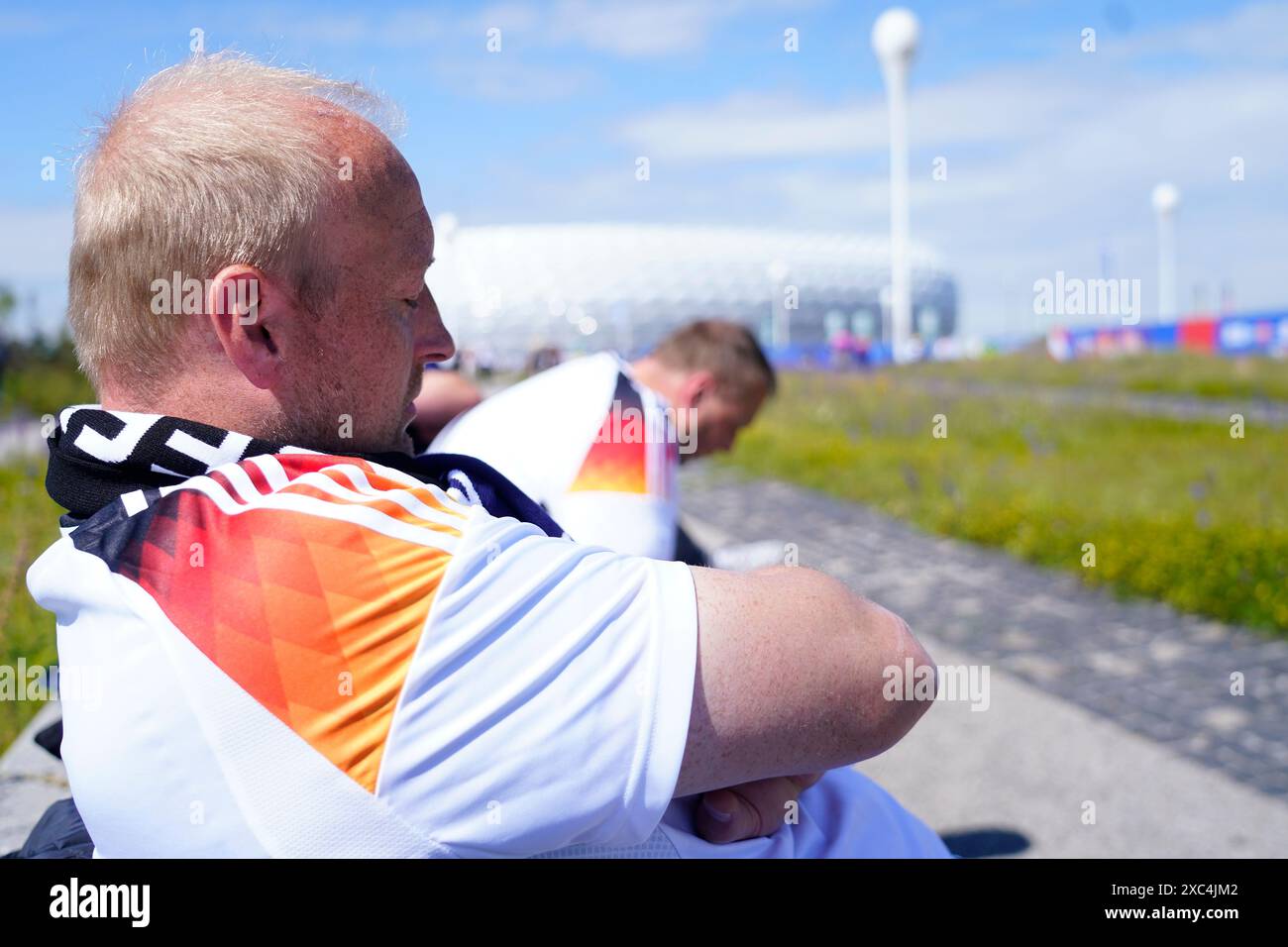 German fan sleeping outside of Allianz Arena Stadium four hours before the kickoff during the