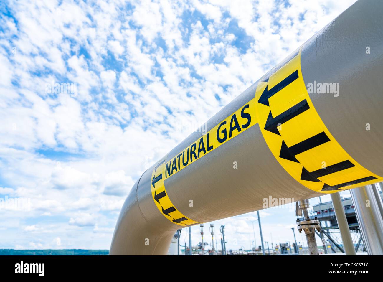 Natural gas pipeline with high pressure and direction sign at ...