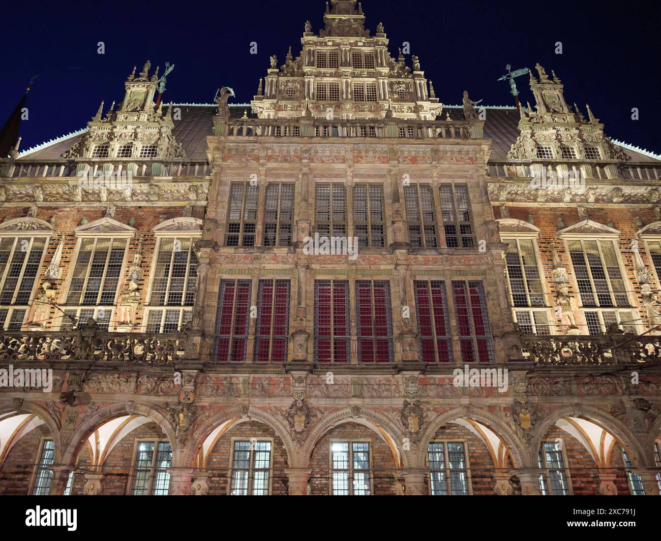 Illuminated gothic building at night with windows and architectural ...
