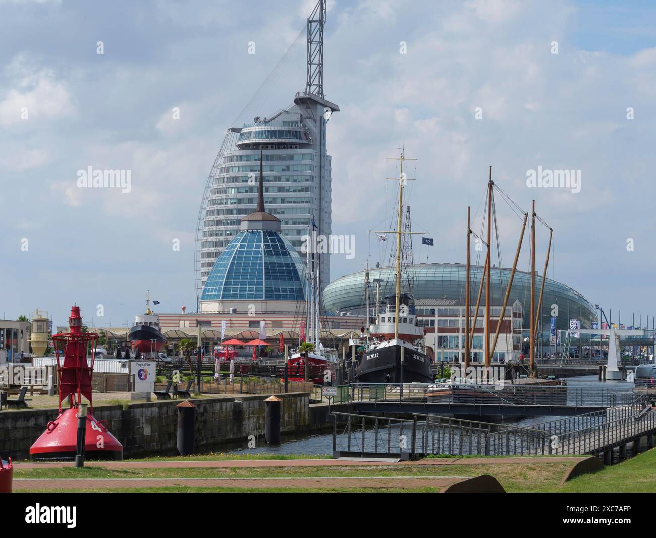 Modern buildings and ships in the harbour, with lighthouse and maritime atmosphere, bremerhaven, bremen, germany Stock Photo