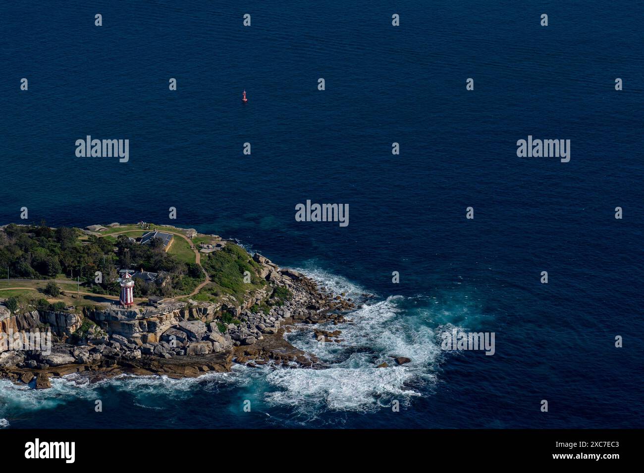 Aerial view of Hornby Lighthouse on South Head, Sydney, Australia, surrounded by blue ocean waters rocky coastline Stock Photo