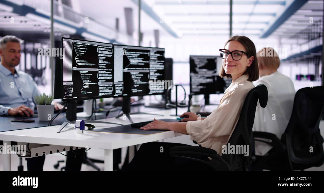 African American Coder Using Computer At Desk. Web Developer Stock Photo