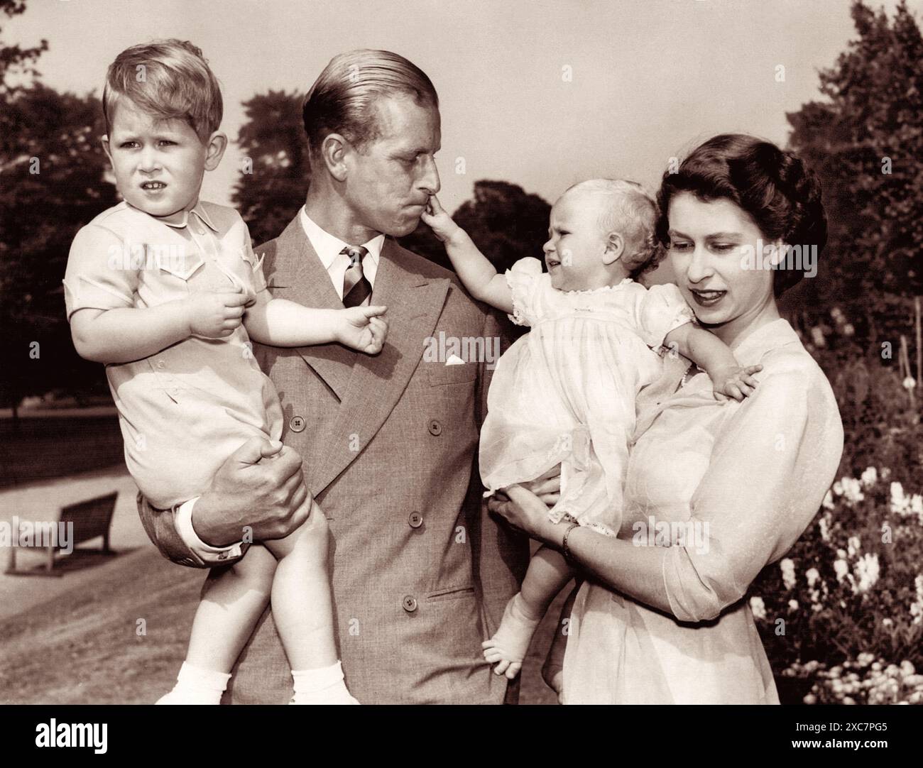 Prince Philip, Princess Elizabeth, and their children Charles and Anne, at Clarence House in London on August 10, 1951. (UK) Stock Photo