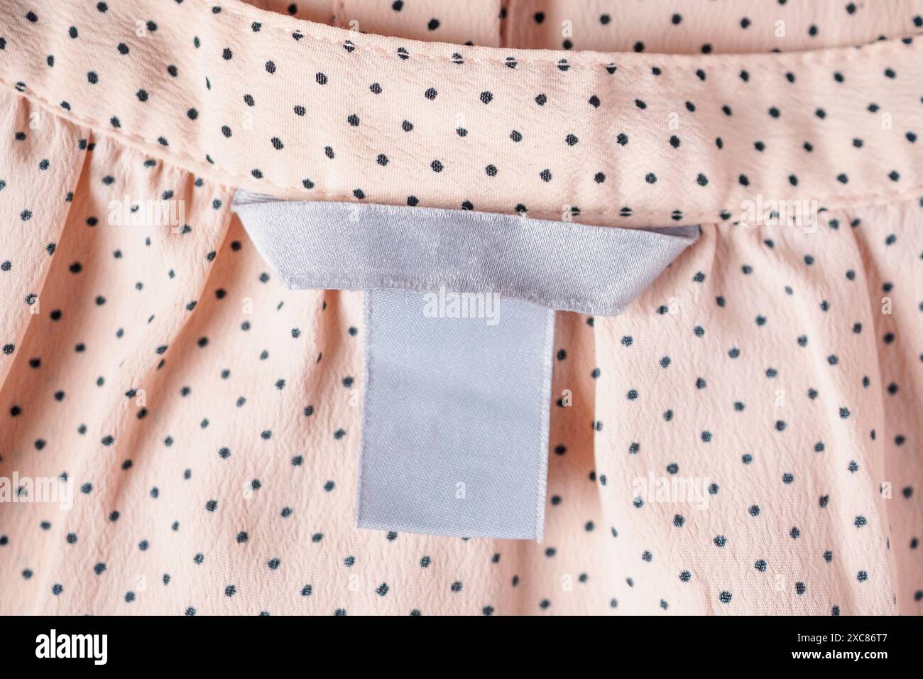 Blank Clothing label closeup on fabric texture Stock Photo - Alamy