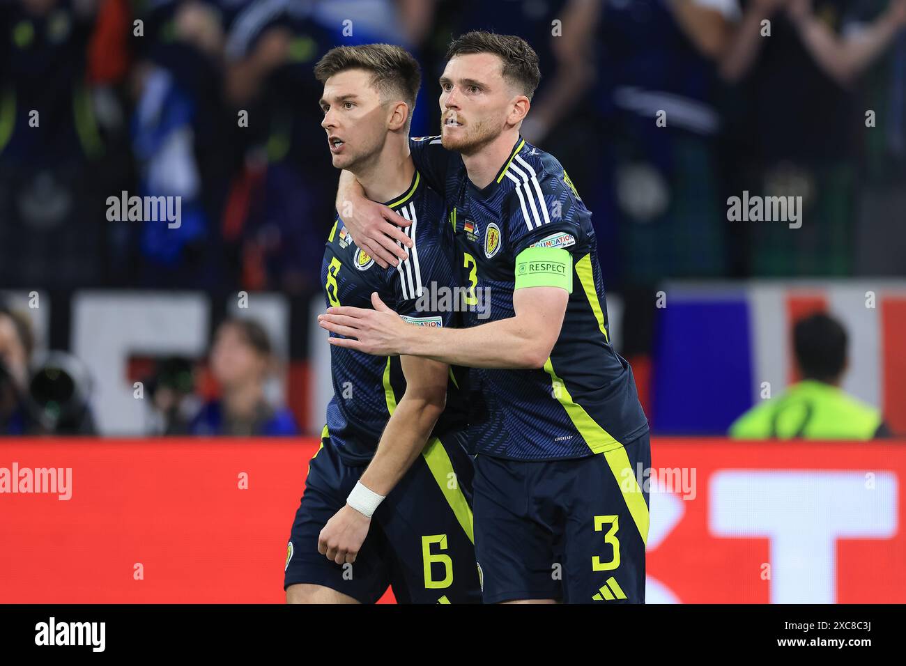 Kieran Tierney (Scotland) is hugged by Andrew Robertson (Scotland) during the UEFA European Championship Group A match between Germany and Scotland at Allianz Arena, Munich on Friday 14th June 2024. (Photo: Pat Scaasi | MI News) Credit: MI News & Sport /Alamy Live News Stock Photo