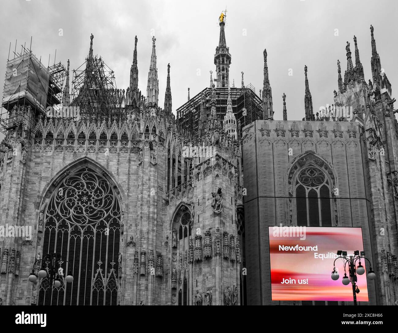 B&W with selective color. Maxi screen (Samsung LedWall) on the exterior of the Milan Cathedral, Milan, Lombardy, Italy Stock Photo
