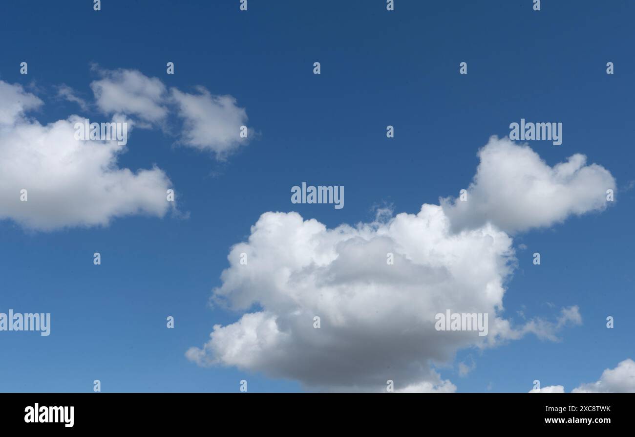 Cumulus clouds in blue sky Stock Photo