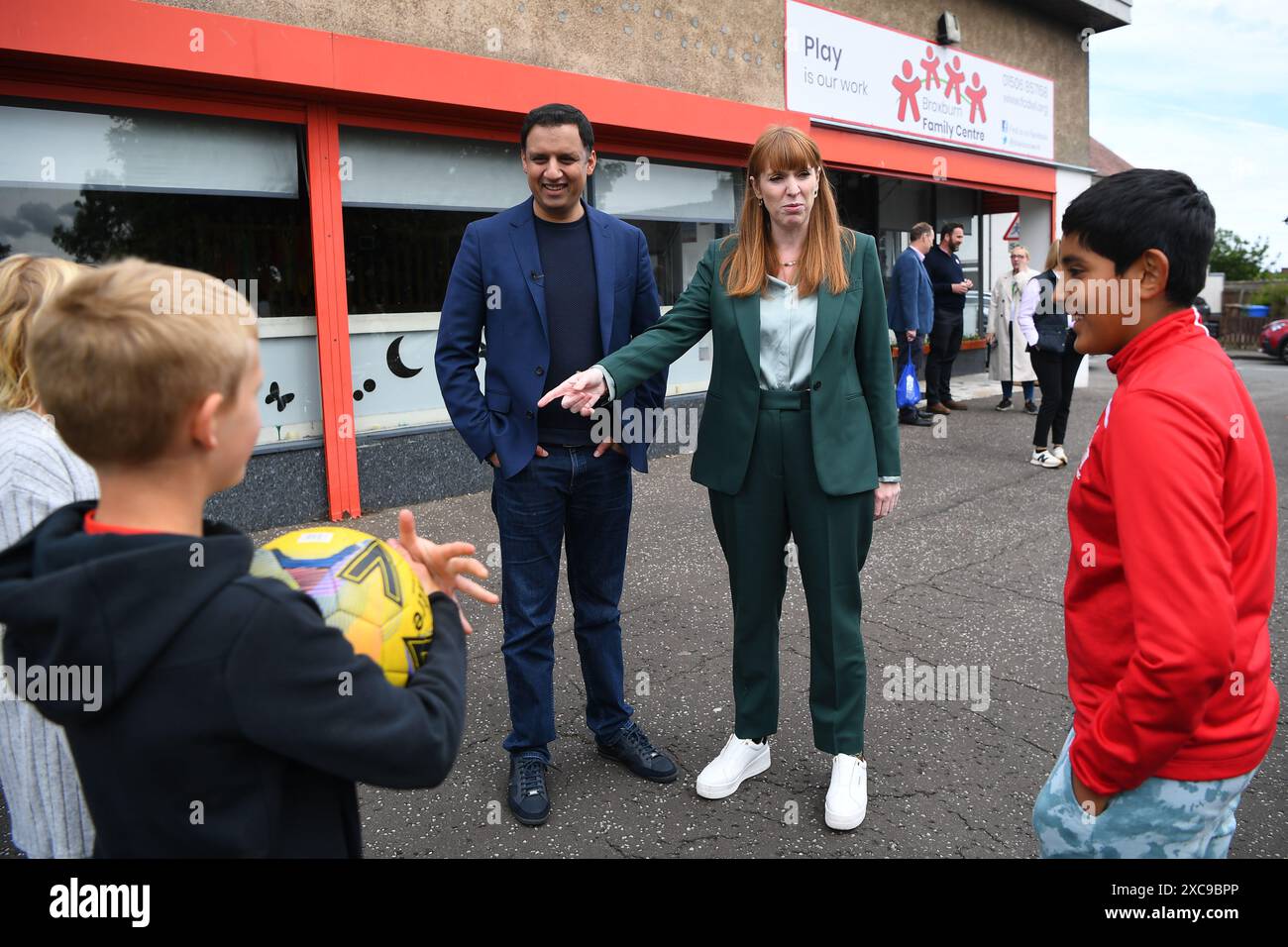 Deputy Labour leader Angela Rayner and Scottish Labour leader Anas Sarwar talking to children at Broxburn Family and Community development centre in Livingston while on the General Election campaign trail. Picture date: Saturday June 15, 2024. Stock Photo