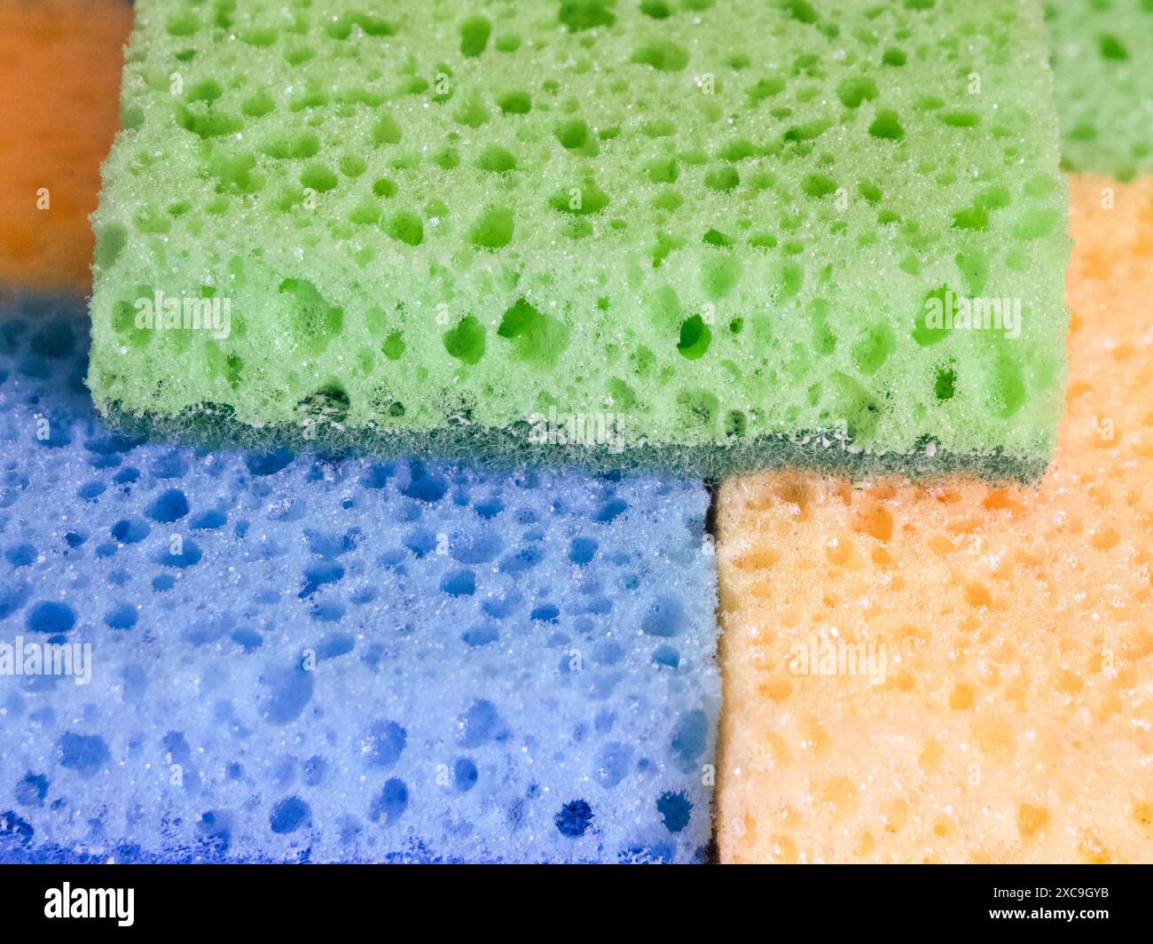 Scrubbing Spectrum. A spectrum of sponges from blue to yellow. Uses for Color theory discussions, art projects. Stock Photo