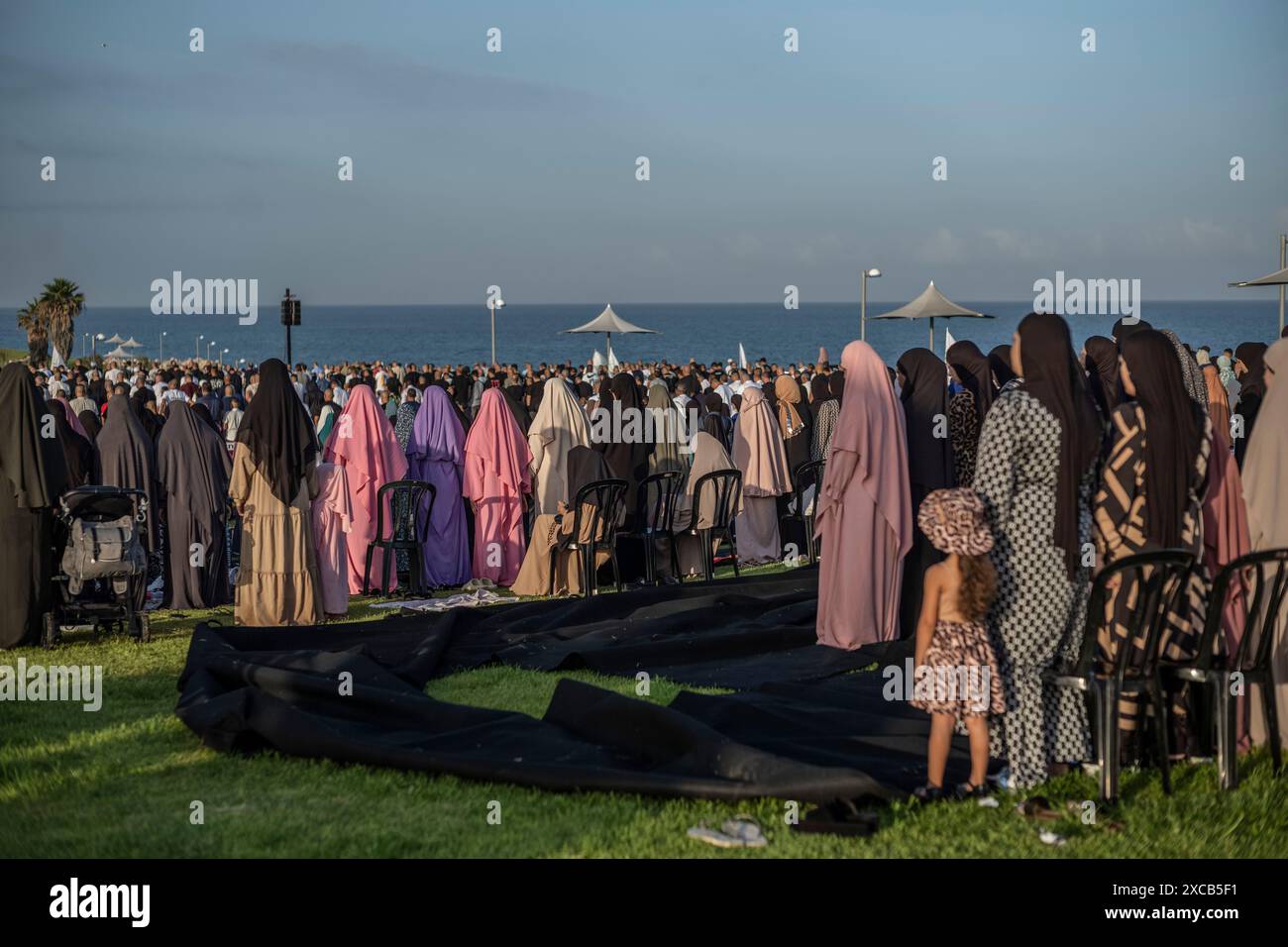 Tel Aviv, Israel. 16th June, 2024. Muslims perform Eid al-Adha prayers at Jaffa. Eid al-Adha is the holiest feast in Islam, during which Muslims slaughter cattle and sheep to commemorate the willingness of the Prophet Ibrahim (Abraham) to sacrifice his son Ishmael. Credit: Ilia Yefimovich/dpa/Alamy Live News Stock Photo