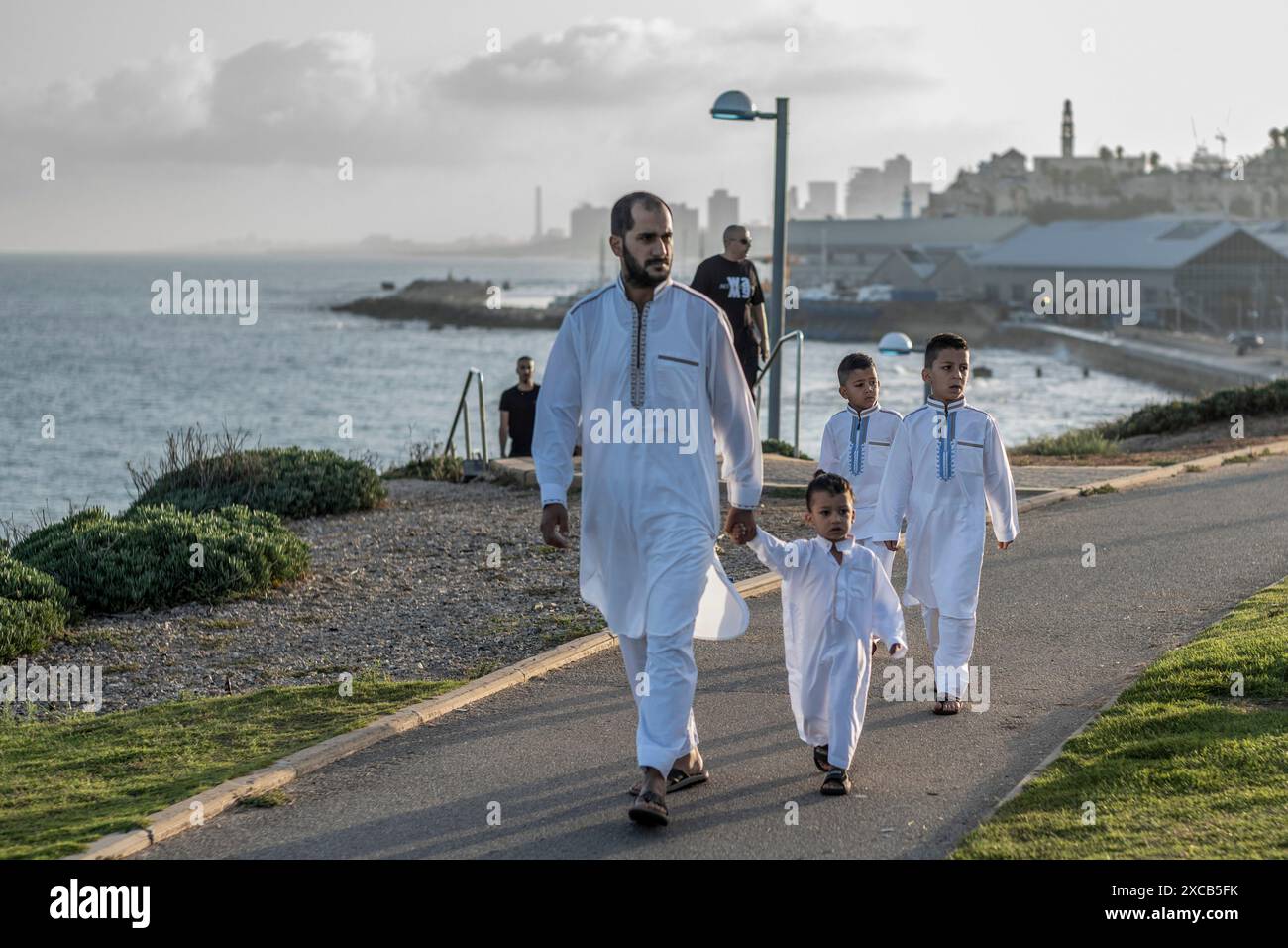 Tel Aviv, Israel. 16th June, 2024. Muslims gather to perform Eid al-Adha prayers at Jaffa. Eid al-Adha is the holiest feast in Islam, during which Muslims slaughter cattle and sheep to commemorate the willingness of the Prophet Ibrahim (Abraham) to sacrifice his son Ishmael. Credit: Ilia Yefimovich/dpa/Alamy Live News Stock Photo