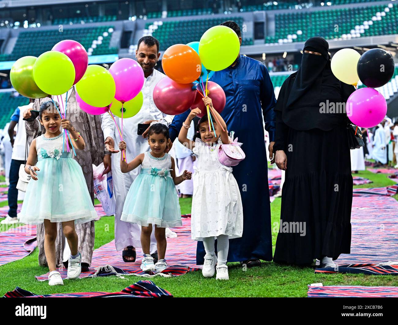 EID ALADHA PRAYER 2024 DOHA Children celebrate with balloons after Eid
