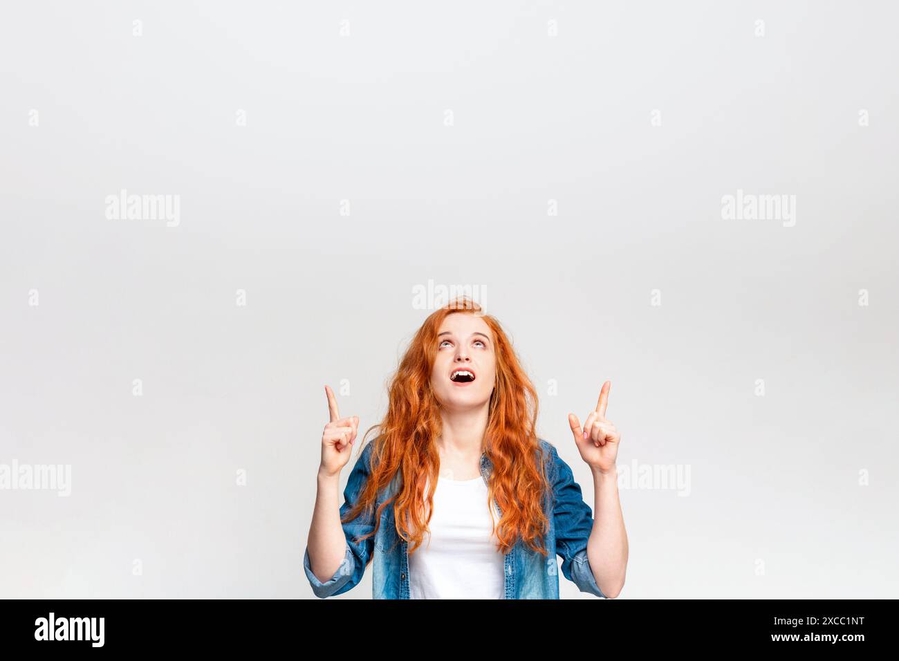 Woman finger pointing unseen object hi-res stock photography and images ...