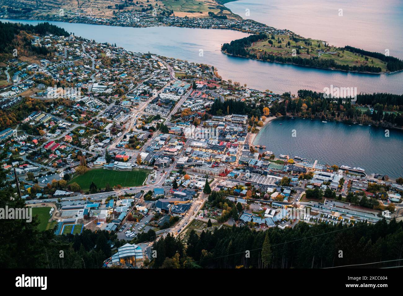 Aerial view of illuminated Queenstown with Lake Wakatipu and the road ...