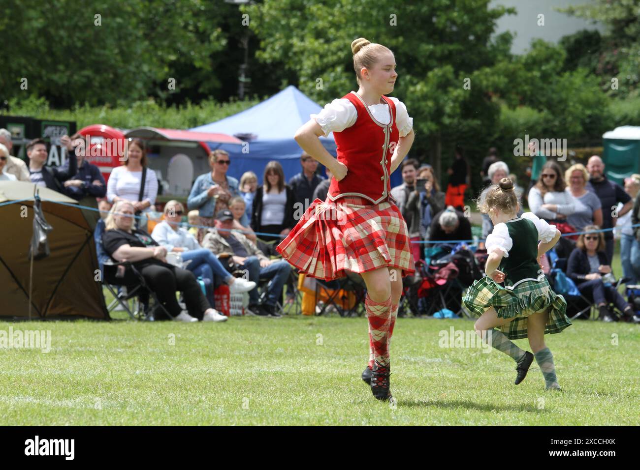 Colchester, UK. 16th Jun 2024. Pipes and drums from across the south of England come together in the Lower Castle Park, Colchester. Medleys of Scottish tunes are being performed together with displays of Highland Dancing. First organised in 1994 the event provides a local contest for pipe bands. Credit: Eastern Views/Alamy Live News Stock Photo