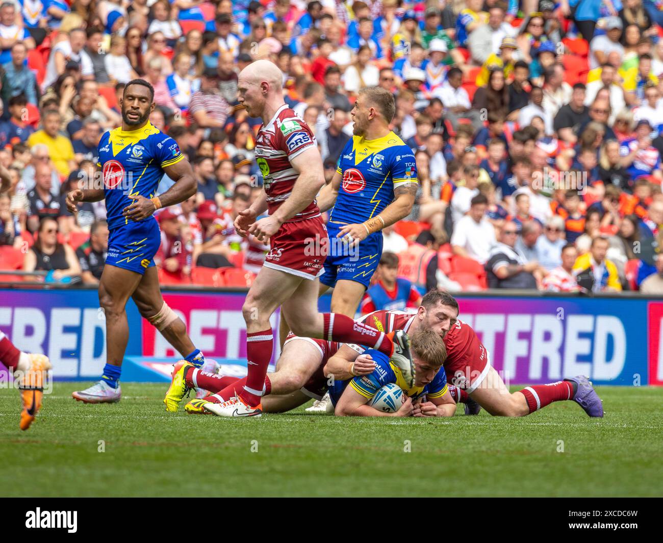 The 2024 Betfred Challenge Cup Final. Sam Powell is tackled by Jake