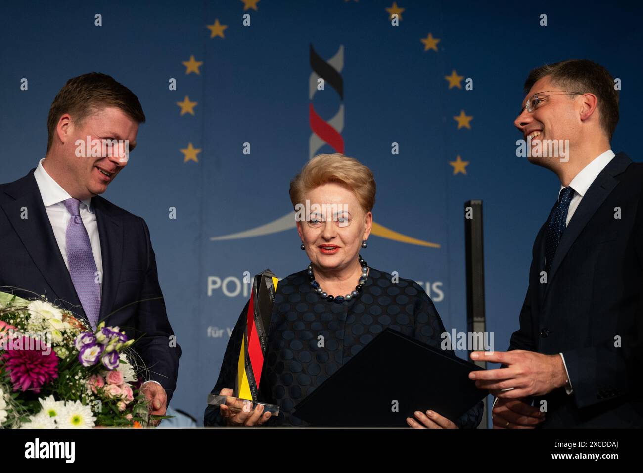 Geisa, Germany. 16th June, 2024. The Chairman of the Board of Trustees of the Point Alpha Foundation, Stefan Heck (l), and the President of the Board of Trustees of German Unity, Christian Hirte (r), present the Point Alpha Prize to former Lithuanian President Dalia Grybauskaite. Credit: Jacob Schröter/dpa/Alamy Live News Stock Photo