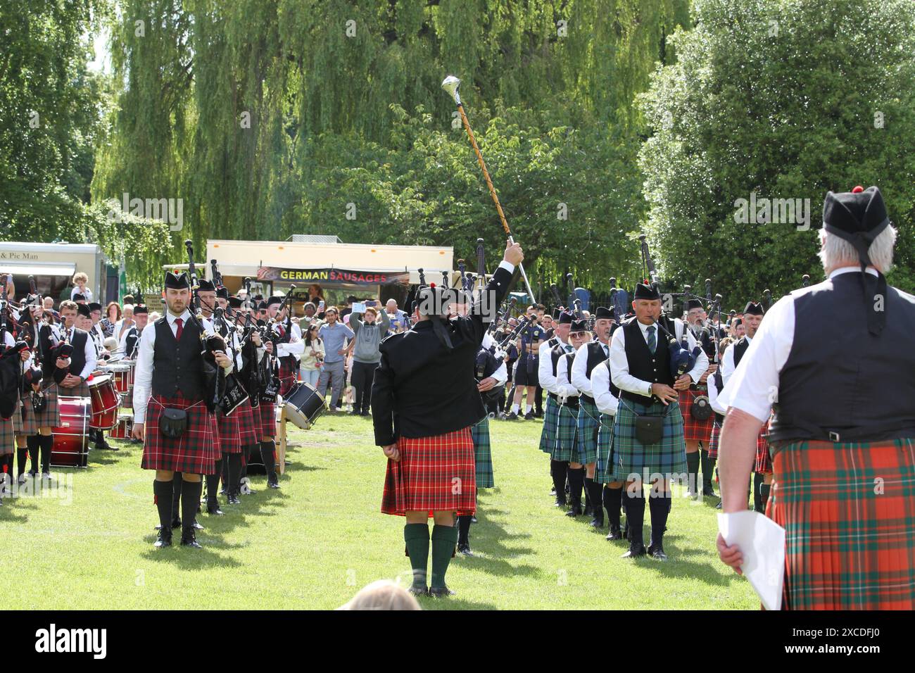 Colchester, UK. 16th Jun 2024. Pipes and drums from across the south of England come together in the Lower Castle Park, Colchester. Medleys of Scottish tunes are being performed together with displays of Highland Dancing. First organised in 1994 the event provides a local contest for pipe bands. Credit: Eastern Views/Alamy Live News Stock Photo