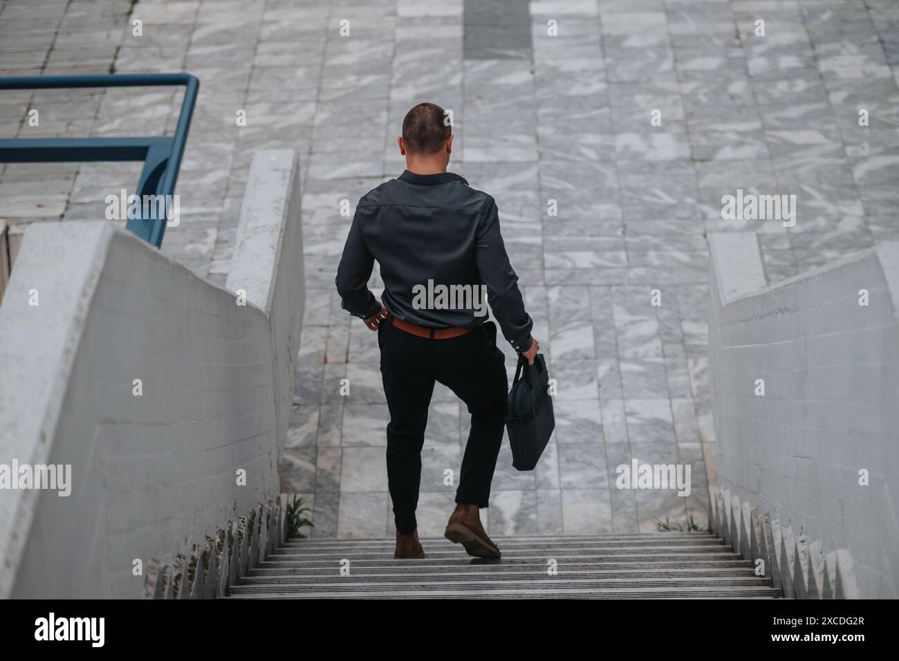 Man walking down steps rear view hi-res stock photography and images ...