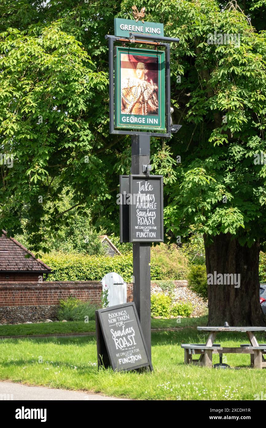 The George Inn at Babraham Green King pub sign and chalkboards South Cambridgeshire Stock Photo