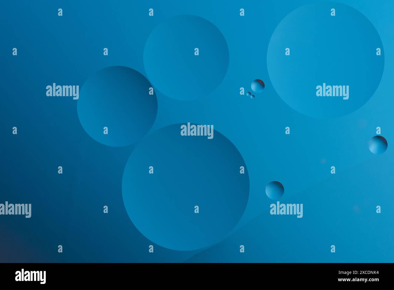 Abstract blue background with dynamic circles of different sizes Stock Photo