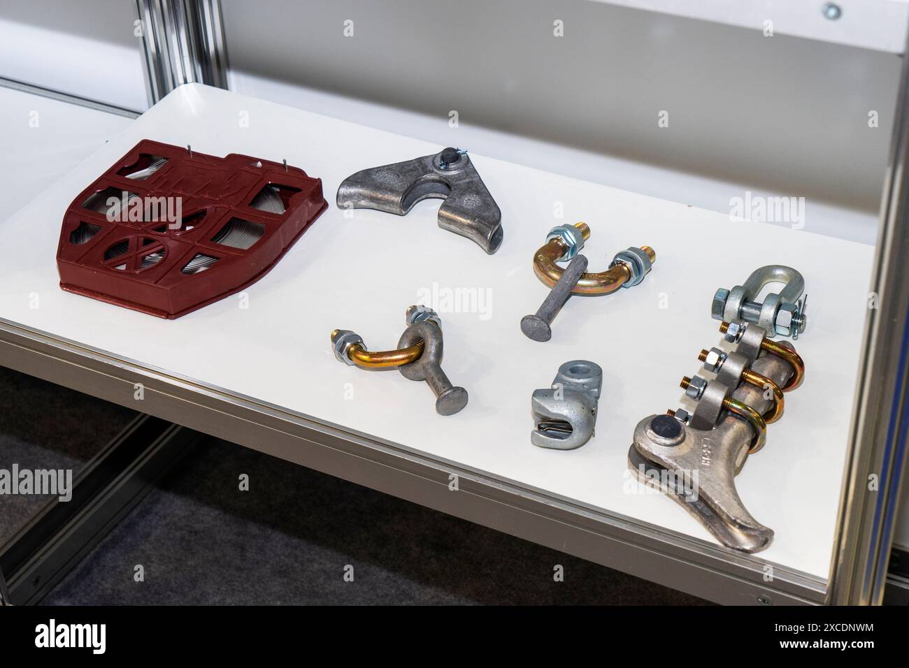 Various iron, glass, ceramic insulators for high-voltage power lines in the shop window. Stock Photo