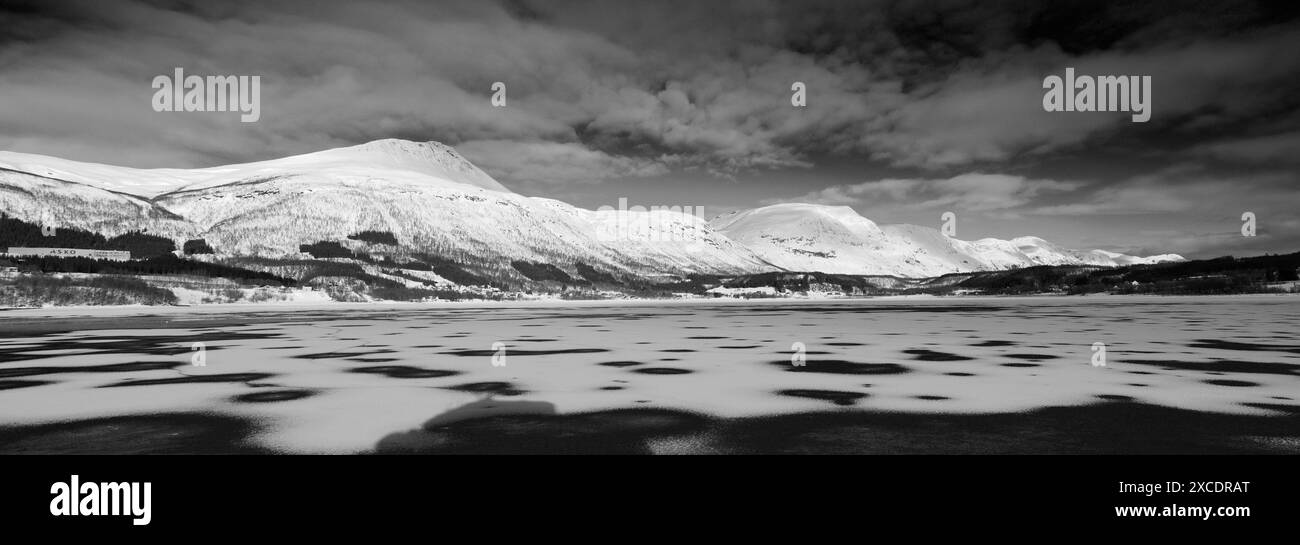 View from a boat of the mountains along Ramfjord, a scenic Fjord south of Tromso city, Northern Norway Stock Photo