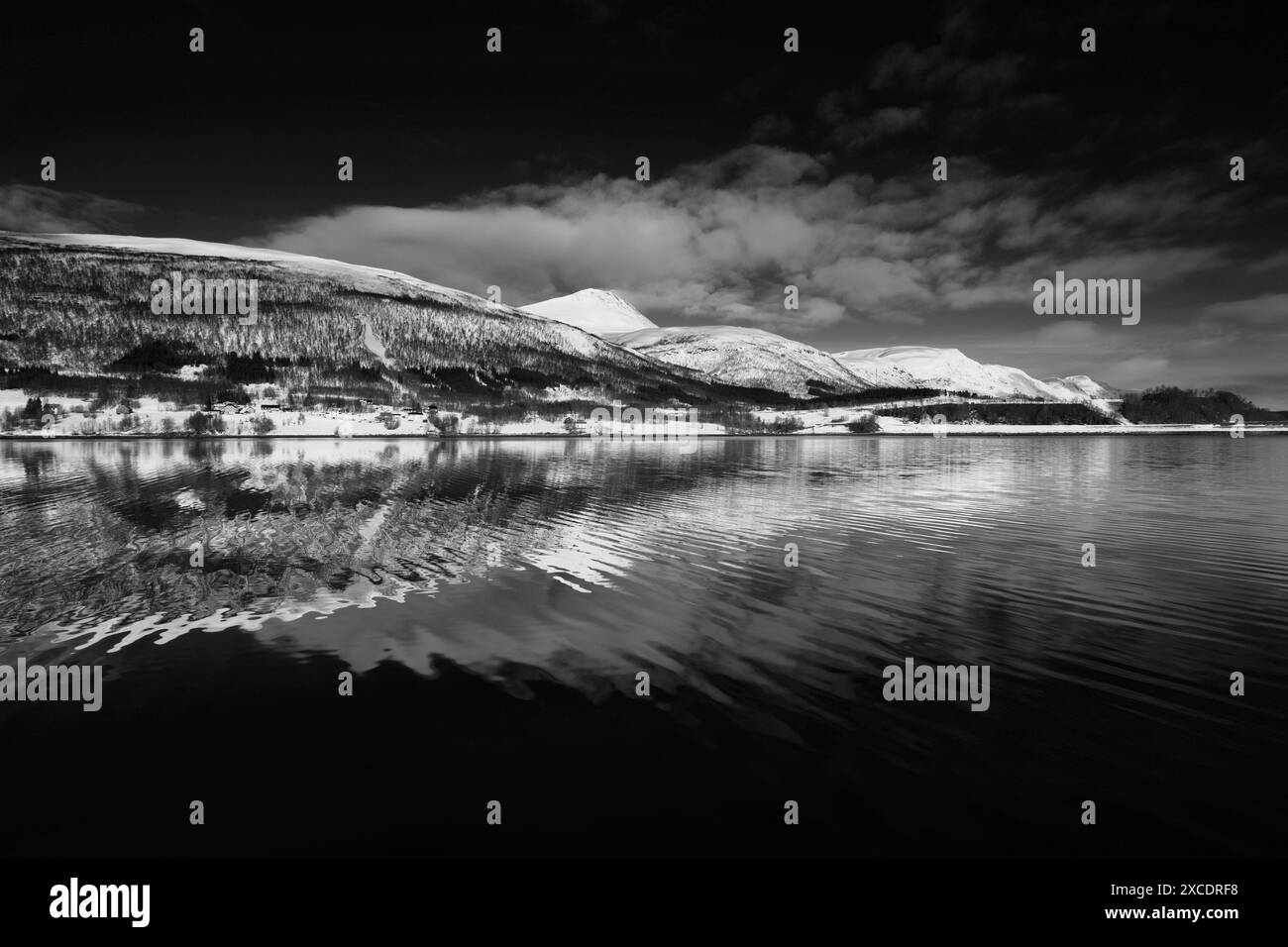 View from a boat of the mountains along Ramfjord, a scenic Fjord south of Tromso city, Northern Norway Stock Photo
