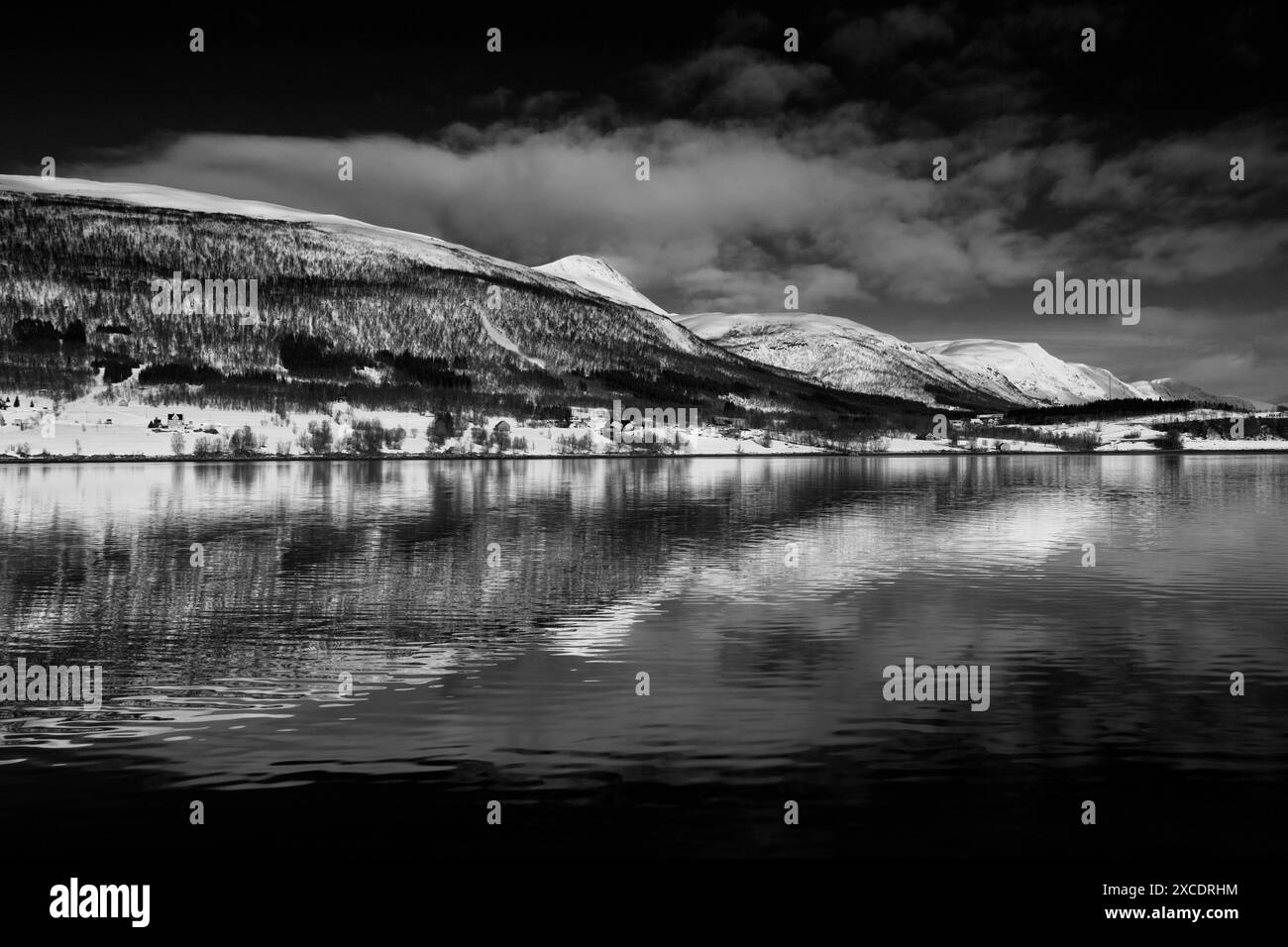 View from a boat of the mountains along Ramfjord, a scenic Fjord south of Tromso city, Northern Norway Stock Photo