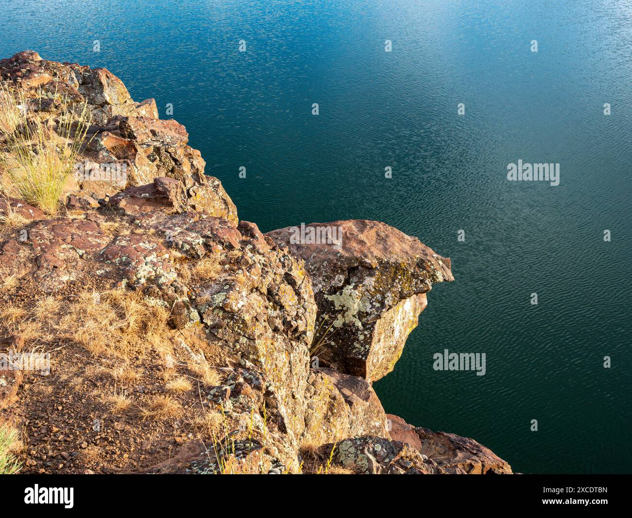 WA25420-00...WASHINGTON  - Fungus spotted basaltic rocks above Canal Lake.,  Seep Lakes Wildlife Area. Stock Photo