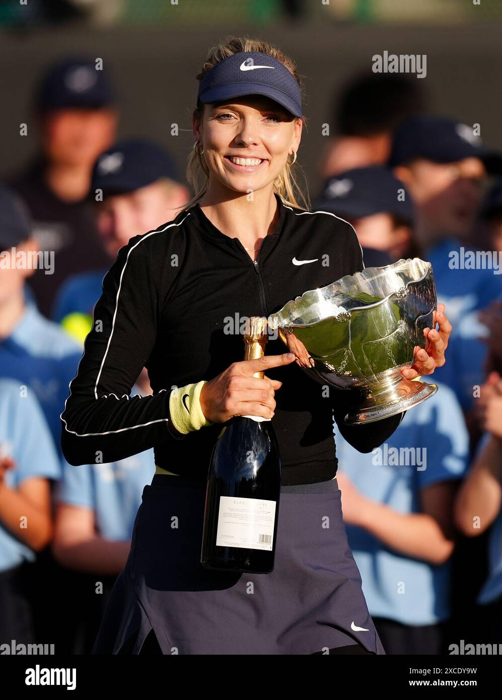 Katie Boulter celebrates with the trophy after winning her women's