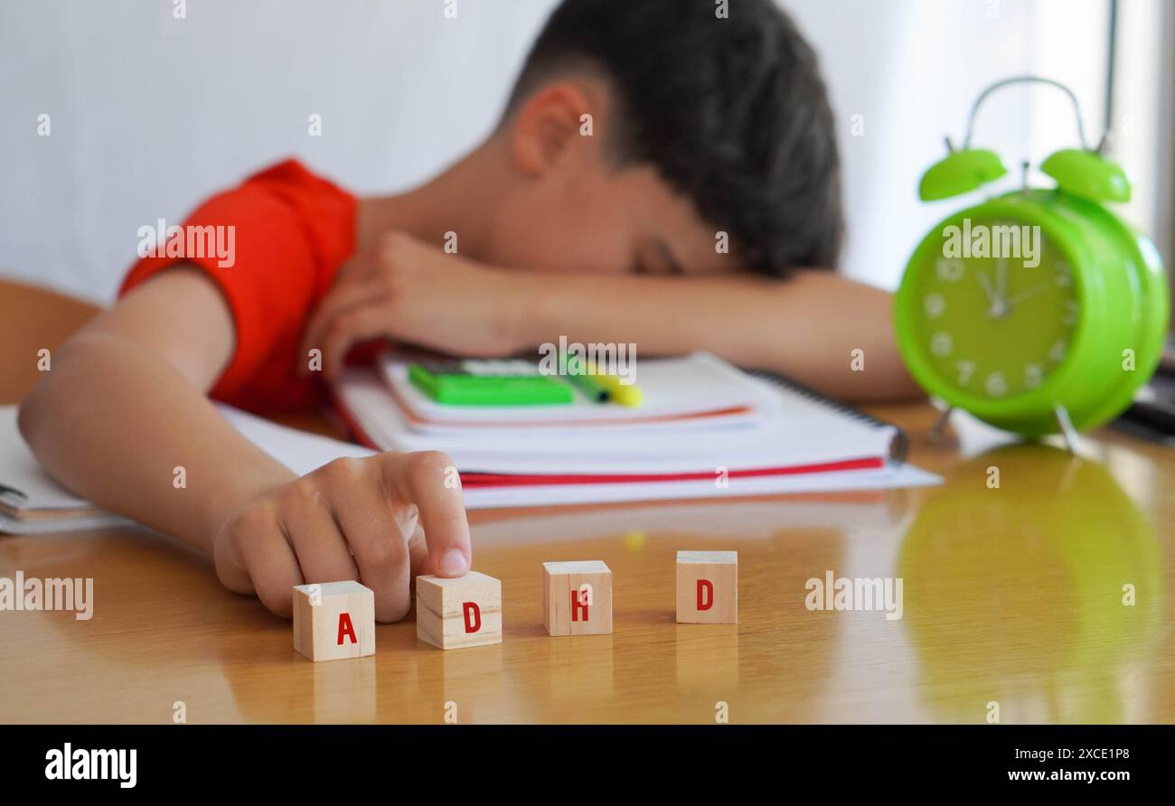 child with attention deficit disorder frustrated doing homework, importance of educational needs and special attention to this problem. Stock Photo