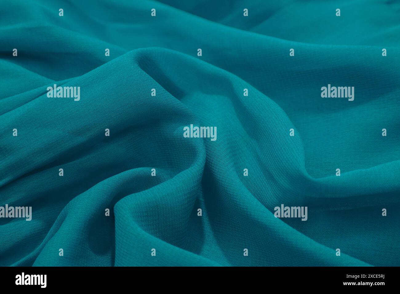 Turquoise fabric folds hi-res stock photography and images - Alamy