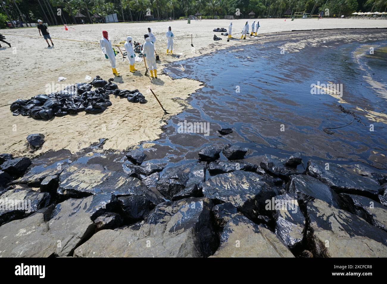  240617 beijing june 17 2024 xinhua workers clean up the oil