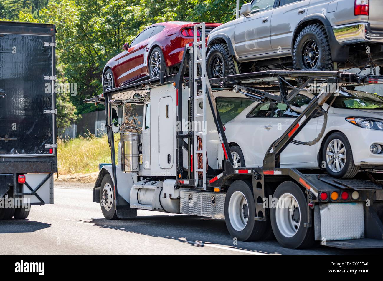 Industrial carrier powered day cab big rig white car hauler semi-truck ...