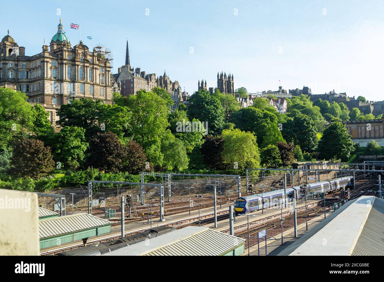 Edinburgh Waverley train station with the Bank of Scotland on the Mound on the right Stock Photo